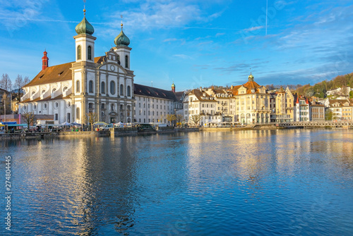 Panoramic view of Lucerne with the bridge Kapellbrucke, Wasserturm Tower and the Church of the Jesuits, Lucerne, Switzerland. © navintar