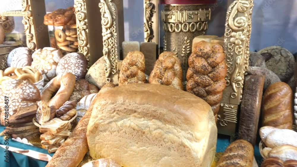 Different kinds of fresh bread on a table. Assortment of bread. Different kinds of fresh bread on a table. Assortment of bread.