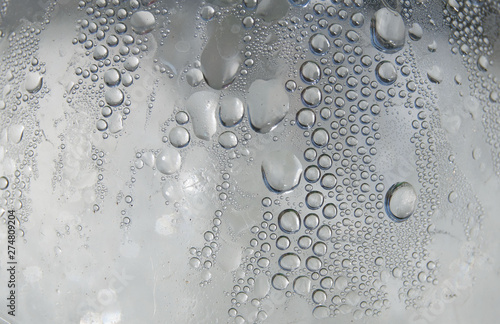 wet glass surface with macro drops