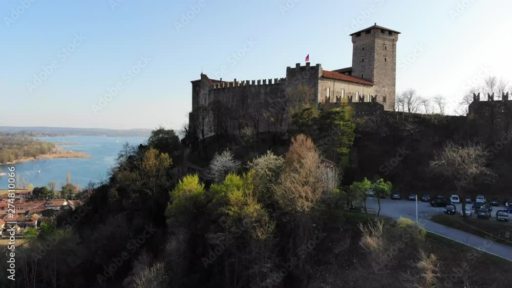 A Mavic Air drone start moving in a lower point of Rocca di Angera and gently lift up to the same level revealing the beautiful Maggiore lake A Mavic Air drone start moving in a lower point of Rocca di Angera and gently lift up to the same level revealing the beautiful Maggiore lake