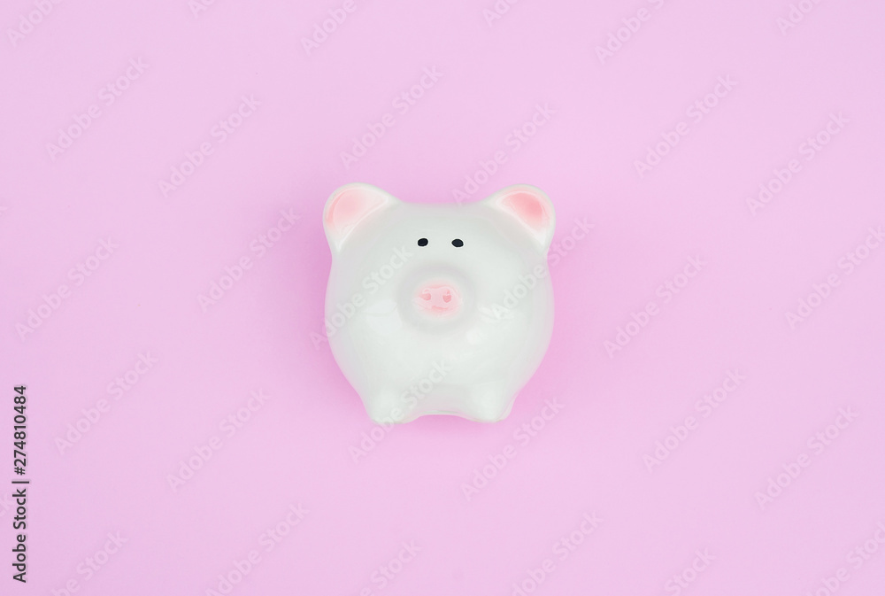 White piggy bank on pink pastel background with copy space as debt or financial problem solution, saving money, finance calculate tax, investment, budget cost and expense.