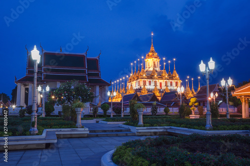 Cityscape Wat Ratchanatdaram Temple the beautiful golden castle or pagoda Bangkok, Thailand in sunset time.
