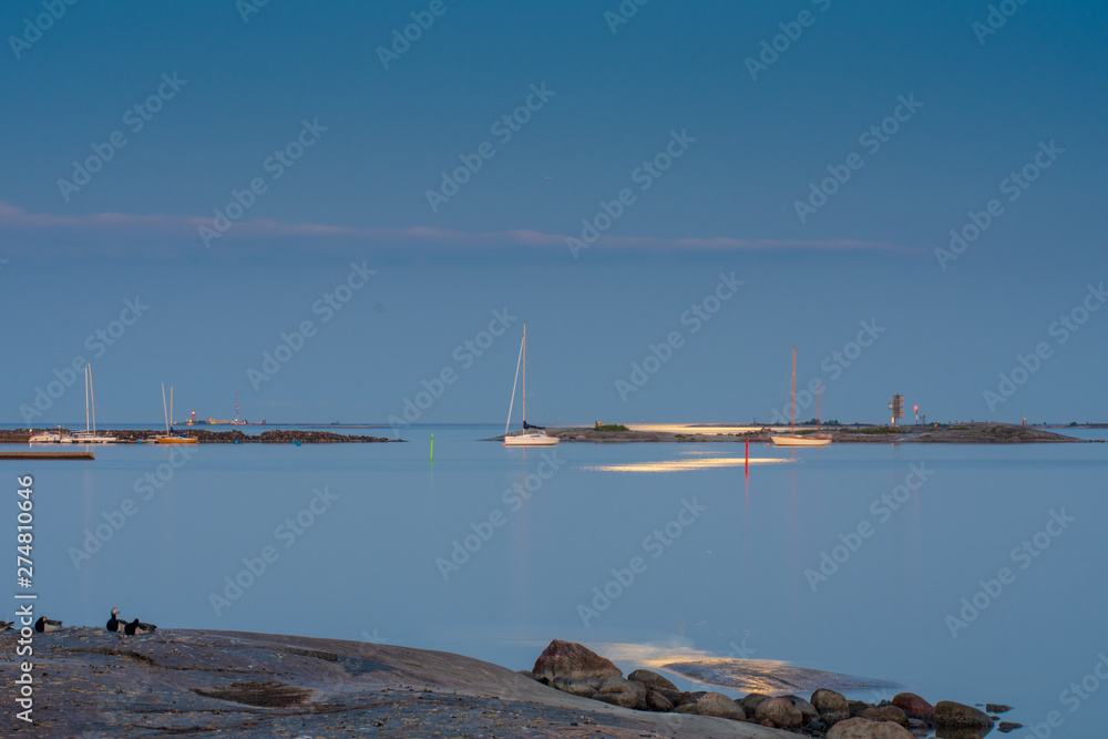 Moon reflection on the water, Harmaja light house in the background