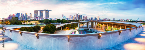SINGAPORE, SINGAPORE - MARCH 2019: Vibrant Singapore skyline with Marina Bay Sands, Gardens by the bay with cloud forest, flower dome and supertrees at sunset. Top view from marina barrage