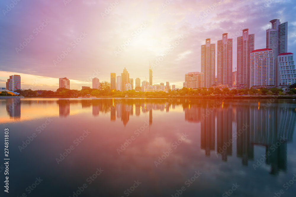 Fototapeta premium City building with water reflection before sunset