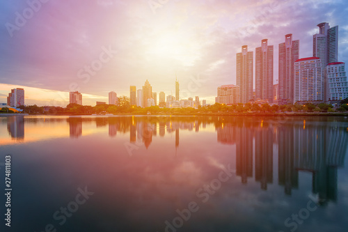 City building with water reflection before sunset