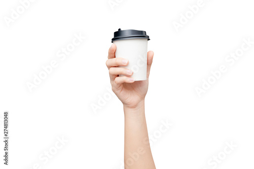 Take away coffee cup background. Female hand holding a coffee paper cup isolated on white background with clipping path. Close-up.