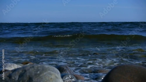 Waves crashing in on Sweden's most famous shoreline for windsurfing in Stockholms south archipelago. photo