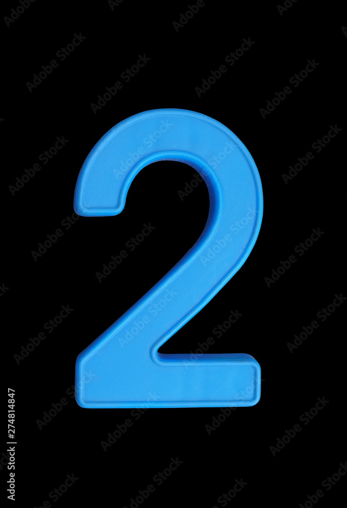 Plastic number isolated on black background, number 2