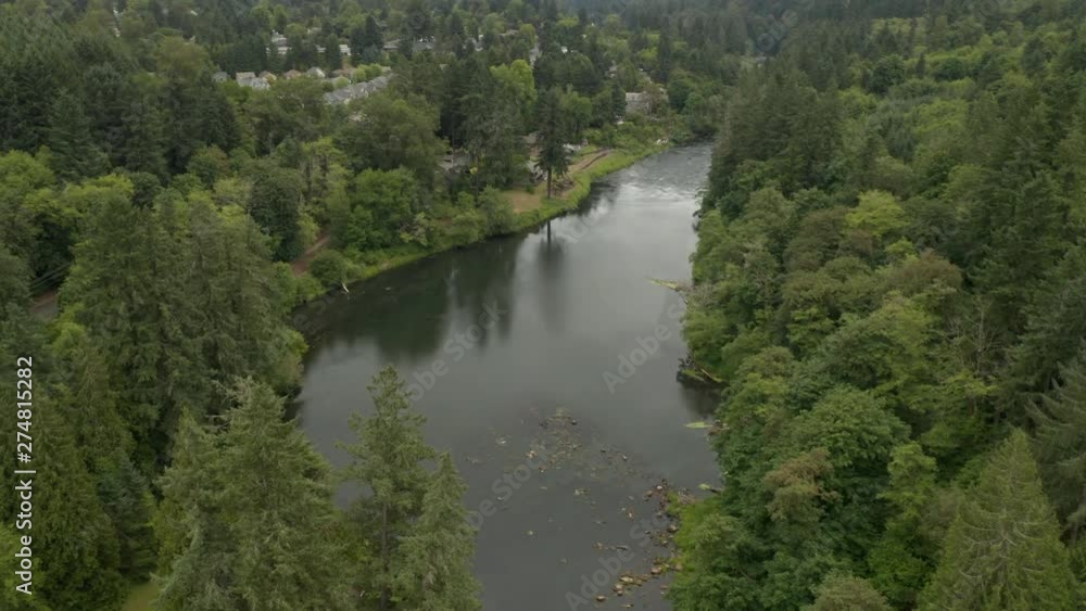 Aerial tilt from tualatin river up to reveal the suburb of west lynn oregon. Aerial tilt from tualatin river up to reveal the suburb of west lynn oregon.
