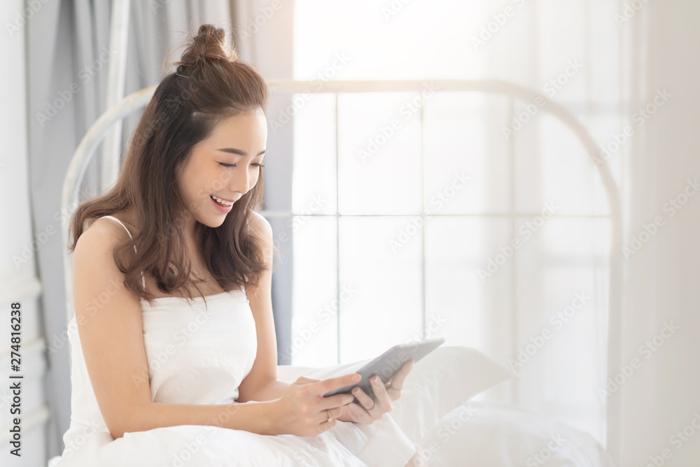 Beautiful girl is doing online shopping on ipad. Beautiful girl is doing online shopping on ipad.