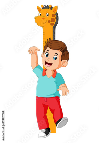 the boy is measuring with body on the giraffe measure height