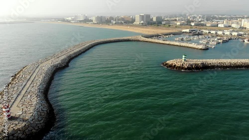 Wallpaper Mural Lighthouses make the entance of a fishing dock in Quarteira Torontodigital.ca