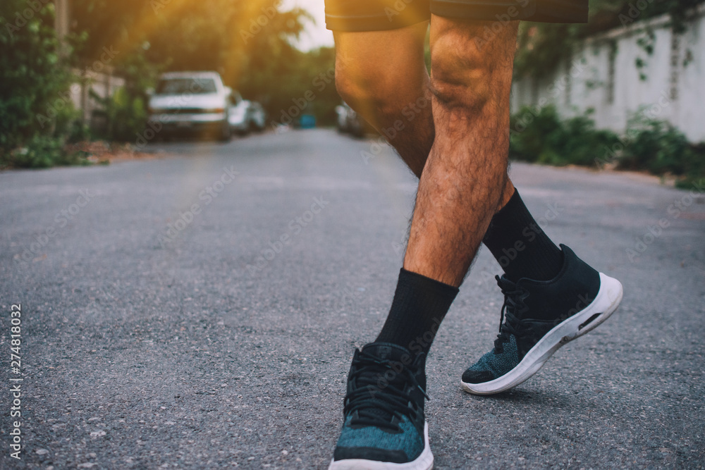 Man run on the street be running for exercise,Run sports background and closeup at running shoe Man run on the street be running for exercise,Run sports background and closeup at running shoe