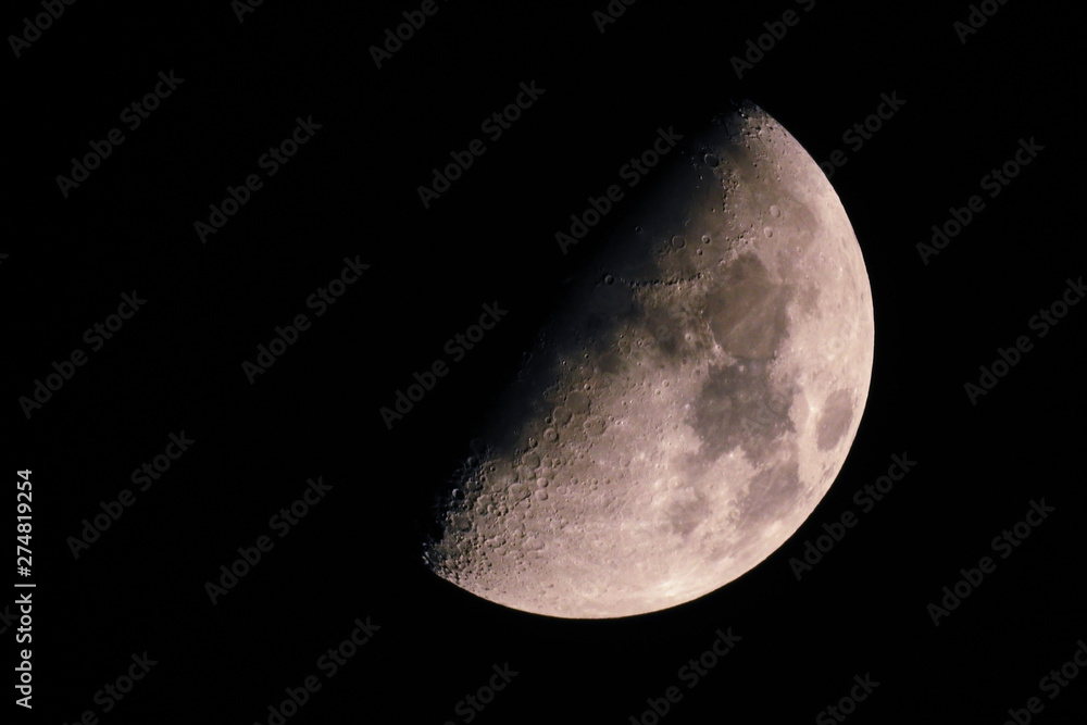 The moon shines on a black background. The moon shines on a black background.
