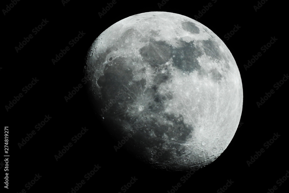 The moon shines on a black background. The moon shines on a black background.