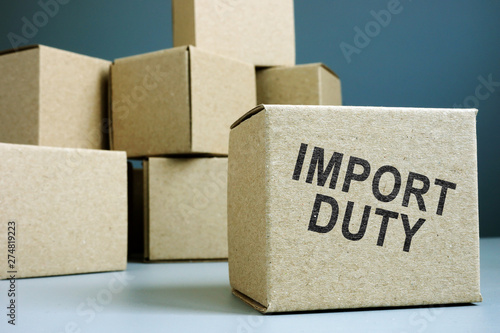 Foto Import duty concept. Pile of cardboard boxes.