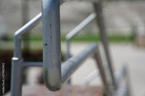 Metal handrails on crossing the road, close-up, shadows