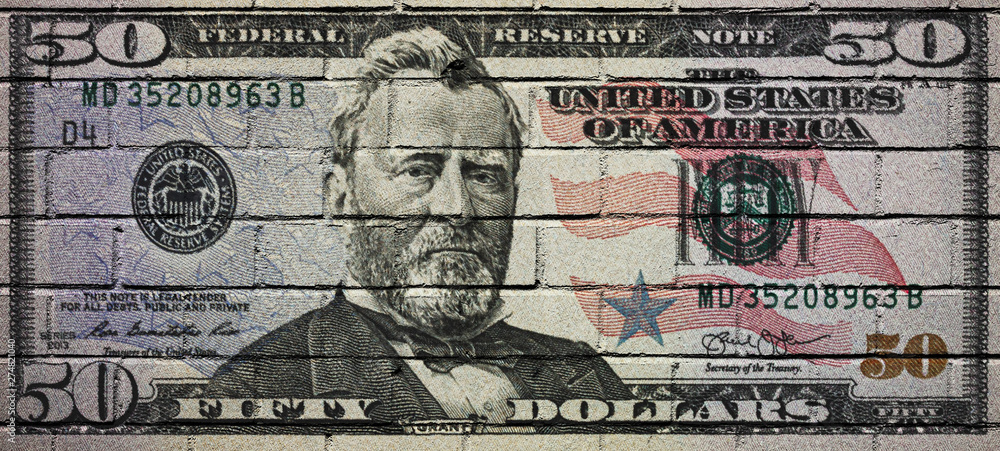 Fototapeta premium US Dollar banknote on a brick wall