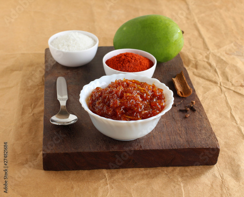 Aam chunda or raw mango preserve is an Indian vegetarian side dish, for items like chapati, poori, roti and idli, native to the state of Gujarat, India. photo