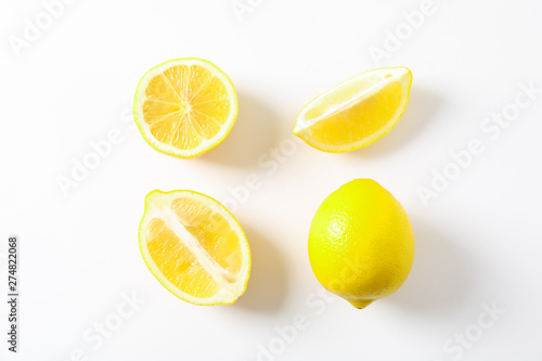 Flat lay composition with lemons on white background, space for text