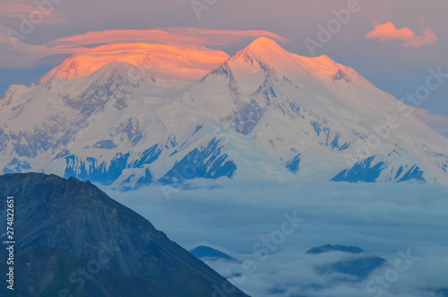 Sunrise view of Mount Denali - mt Mckinley peak with red alpenglow from Stony Dome overlook. Denali National Park and Preserve, Alaska, United States