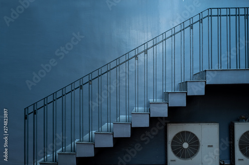 concrete gray wall and stairs up over the air condition