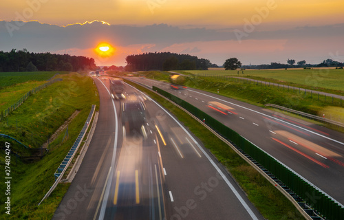 intensive highway traffic at sunset