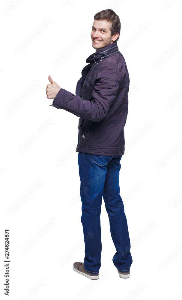 Back view of man in parka thumbs up. Back view of man in parka thumbs up.
