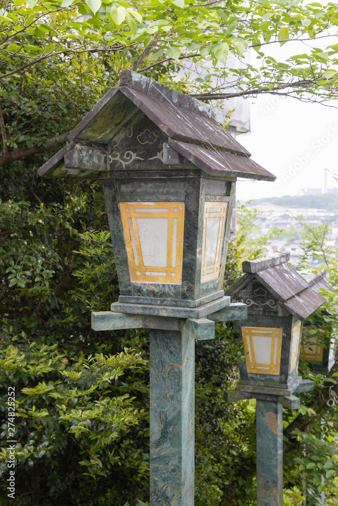 The green traditional light lamp pole at shrine, Japan style. The green traditional light lamp pole at shrine, Japan style.