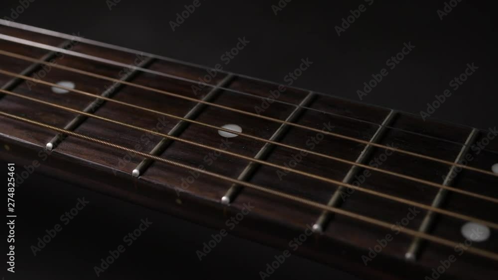 Close up vibrating string acoustic guitar Close up vibrating string acoustic guitar