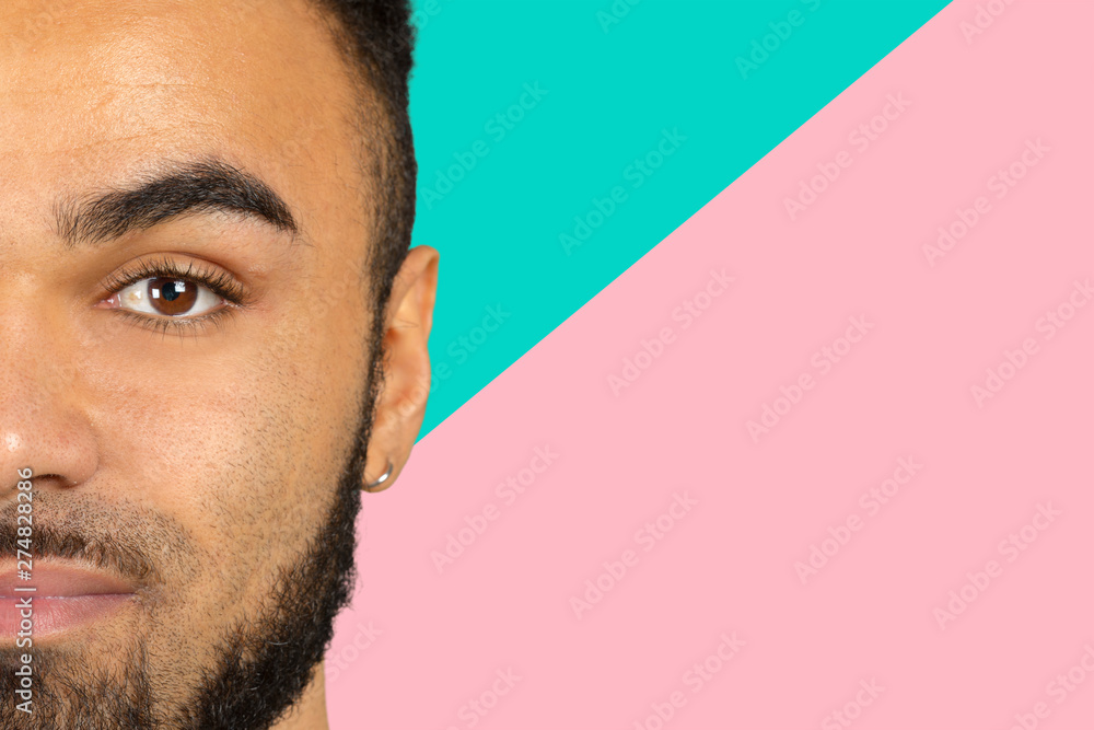 Cropped image of young African man with emotional face