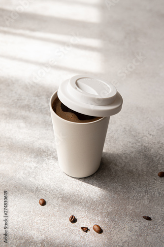 americano coffee in paper cup, morning natural light