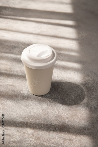americano coffee in paper cup, morning natural light