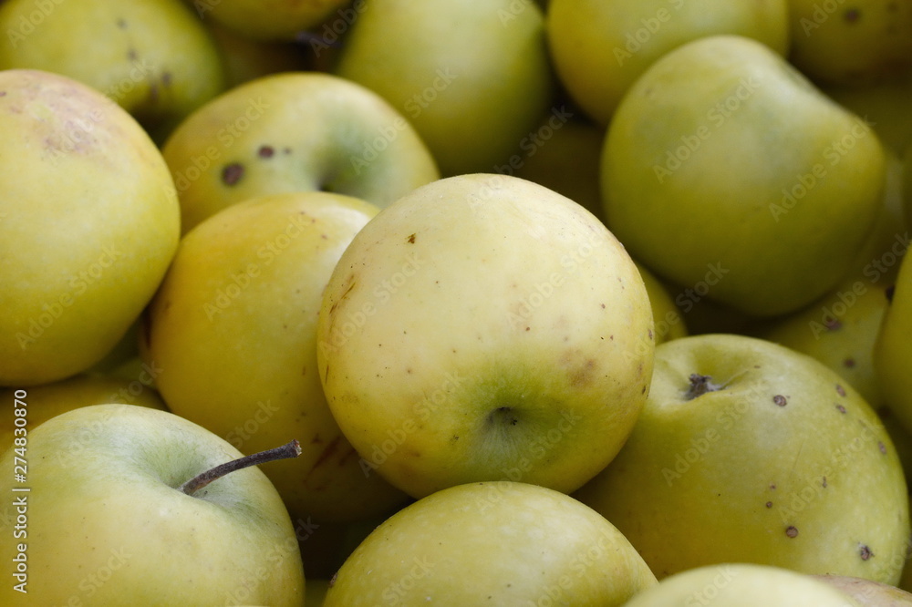 Apples on the market. Fresh organic yellow apples from the local farmers market. Apples background background texture seasoning Apples for sale. Apples on the market. Fresh organic yellow apples from the local farmers market. Apples background background texture seasoning Apples for sale.