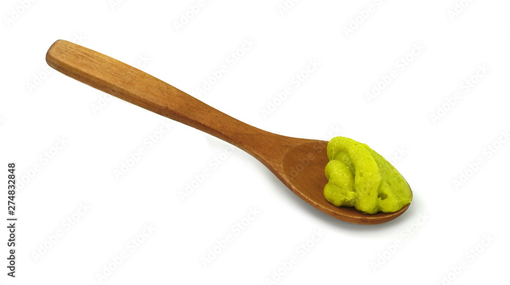 Green wasabi sauce in small wooden spoon isolated on white background Green wasabi sauce in small wooden spoon isolated on white background