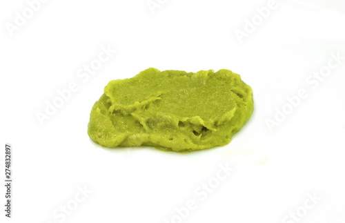Puddle of green wasabi dressing or wasabi sauce spot isolated on white background.