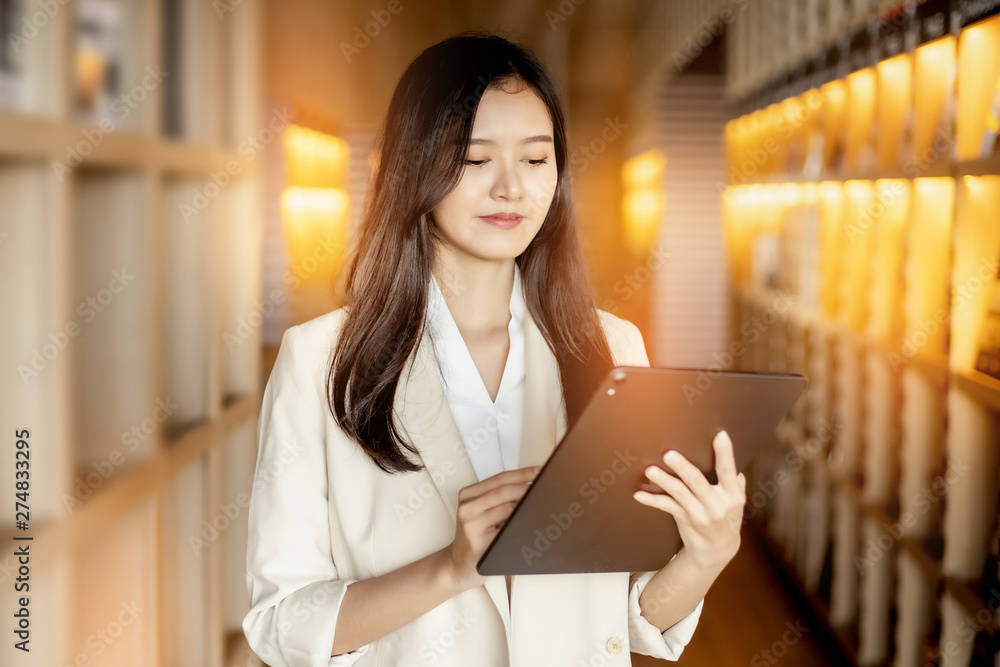 Smiling Asian business woman looking at the camera stay office.young Asian business executive happy. Smiling Asian business woman looking at the camera stay office.young Asian business executive happy.
