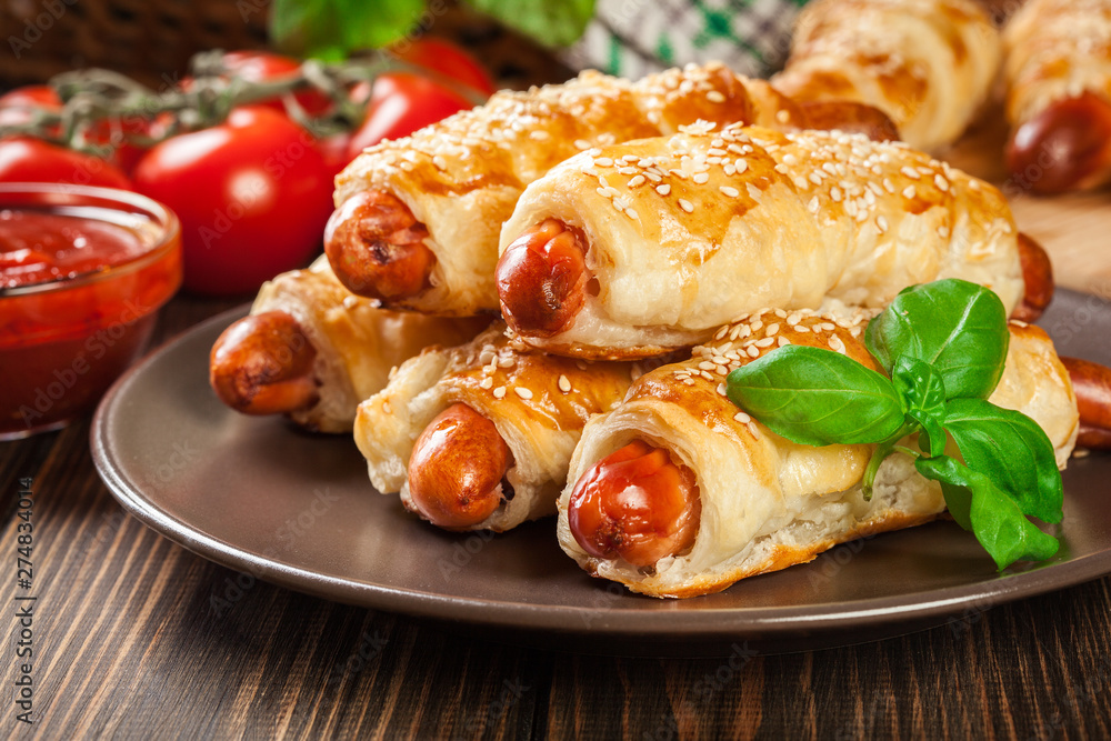Rolled hot dog sausages baked in puff pastry Rolled hot dog sausages baked in puff pastry