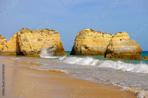 View on beautiful cliffs in Algarve. Beach Careanosy in Portimao. Vacation in Portugal. photo