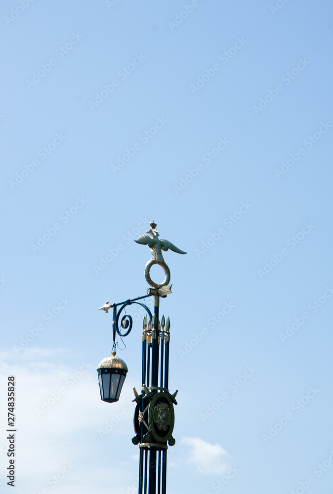 wrought lantern against blue sky wrought lantern against blue sky