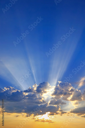 cloudy sky with penetrating sunshine