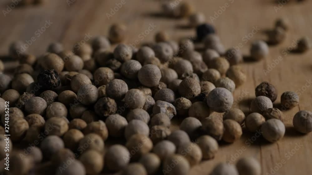 close up pepper grains on wood table close up pepper grains on wood table
