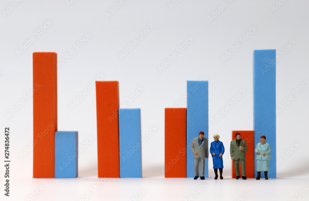 Miniature people standing in front of a bar graph. Concept on the Growing Elderly Population. Miniature people standing in front of a bar graph. Concept on the Growing Elderly Population.