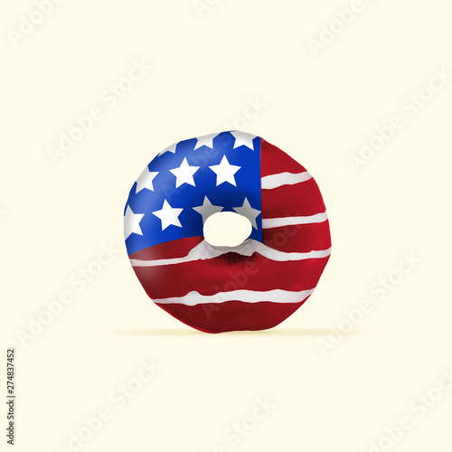 An altrnative view of Stars and Stripes  flag of United States of America as a sweets  donut on yellow background. Modern design. Contemporary art. Creative conceptual and colorful collage.