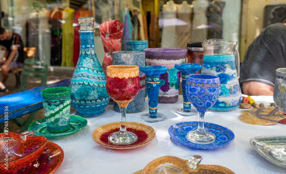 beautiful handmade colorful glass crockery sold at handicraft market. Israel