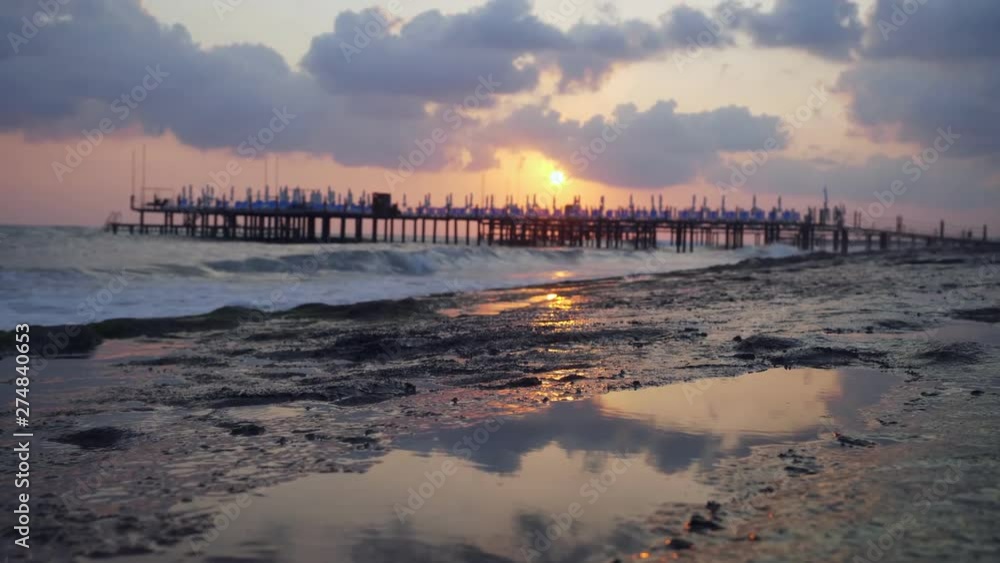 Beautiful view on coast pier on rocky beach. Beautiful view on coast pier on rocky beach.