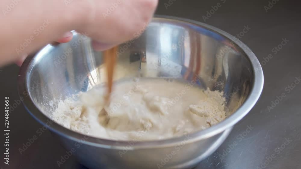 Preparing a mixture of masa flour, water, and salt for masa (corn) tortillas. Homemade, traditional, simple and fresh recipe. Preparing a mixture of masa flour, water, and salt for masa (corn) tortillas. Homemade, traditional, simple and fresh recipe.