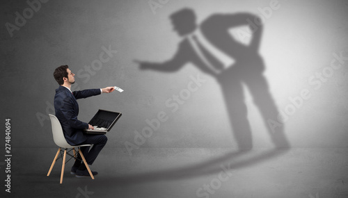 Obraz na plátně Businessman staying and offering stuffs to a shadow businessman