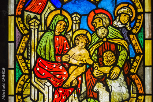 MALBORK, POLAND, 26 AUGUST 2018: Gothic and coloured glass with the holy family in Malbork Church